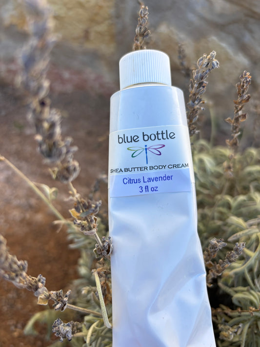 Tube of Blue Bottle body cream on a background of dried lavender plants